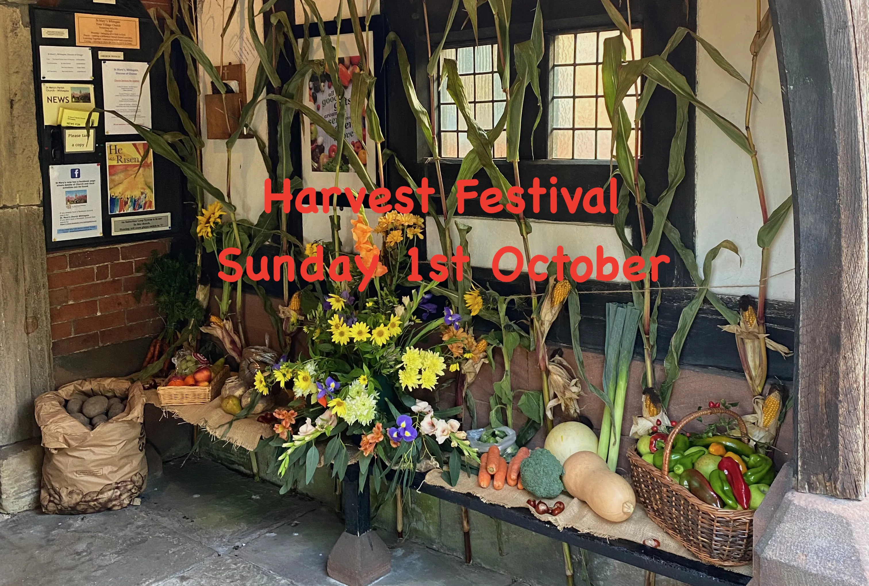 Church porch decorated for harvest festival with the words Harvest Festival, Sunday 1st October imposed.