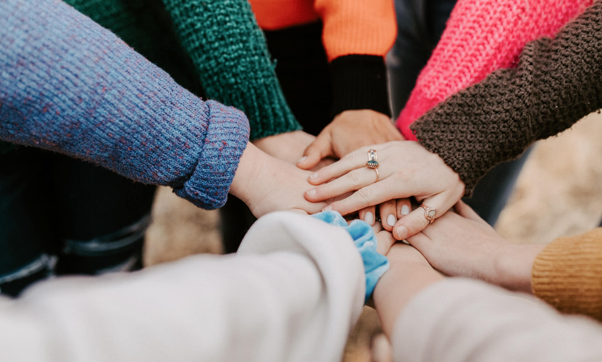 Group of people holding hands